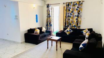Family Apartment | Living area | 24-inch Smart TV with digital channels