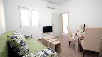 Comfort Apartment | Living area | 32-inch LCD TV with cable channels