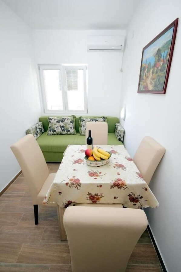 Classic Apartment | Living area | 32-inch LCD TV with cable channels
