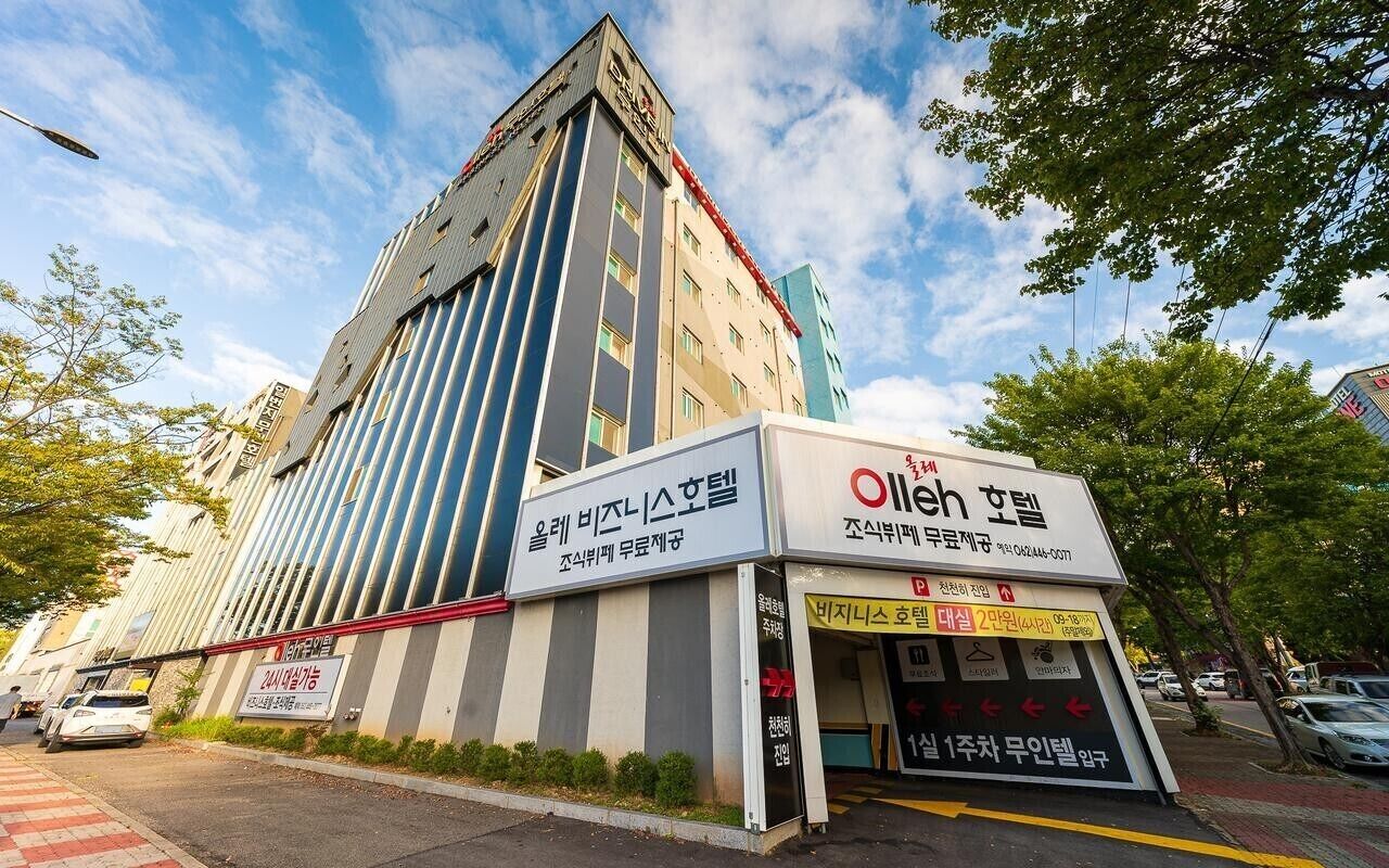 A hotel building with a sign for 'Olleh Spa' and a smaller sign for 'Olleh Spa Hotel'.