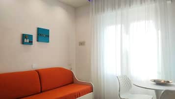 Comfort Suite | Living area | 32-inch flat-screen TV with digital channels