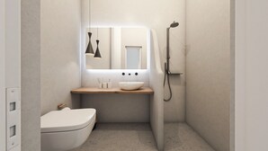 A compact bathroom with a white toilet, a wooden vanity with a white sink, and a shower. - Superior Suite with Caldera View (Thira - Santorini)
