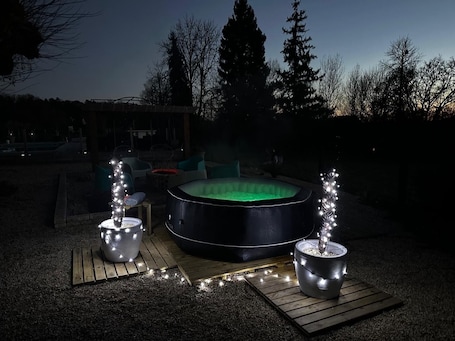 Outdoor spa tub. Charming country house in Coulaures with WiFi