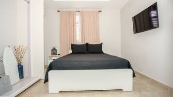 4 bedrooms, down duvets, blackout curtains, iron/ironing board