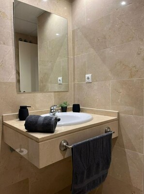 Hair dryer, towels, soap, toilet paper