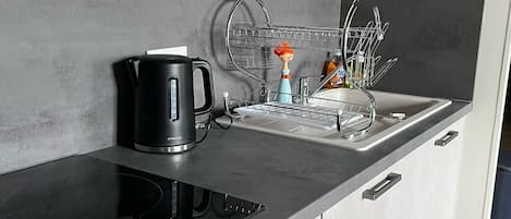 Fridge, microwave, electric kettle, cookware/dishes/utensils