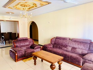 Business Apartment | Living area | 24-inch Smart TV with digital channels - Lux Suites Furaha Holiday Apartments  (Mombasa)