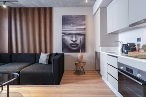 Comfort Apartment | Living area | 50-inch Smart TV with cable channels, Netflix, streaming services