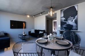 Signature Condo | Living area | 50-inch Smart TV with cable channels, Netflix, streaming services