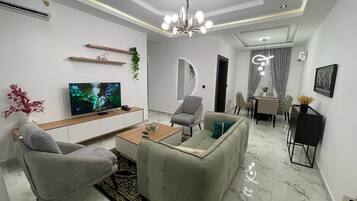 Executive Apartment | Living area | Flat-screen TV