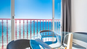 A balcony with a clear view of the sea, a glass table, and two chairs. - Las Damas 12-E Levante Beach (Benidorm)