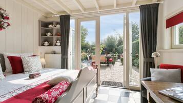 Deluxe Double Room, Garden View, Ground Floor | In-room safe, blackout drapes, soundproofing, iron/ironing board