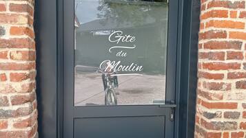 A black door with a glass window.