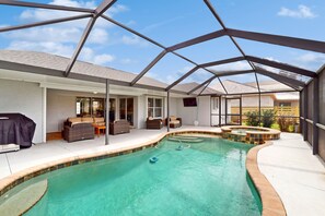 A heated pool - Newly remodeled home with heated pool and pool spa, gas grill, & W/D - dogs ok (Cape Coral)