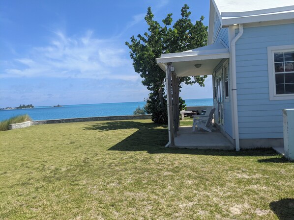 A house with a covered porch overlooking a body of water. - NEW LISTING - Stunning sunsets, turtle watching longtails wheeling & glow worms (Somerset Village)