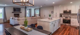 Heron's Cove Lake House with dock and kayaks