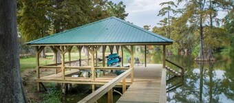 Heron's Cove Lake House with dock and kayaks