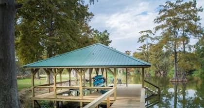 Heron's Cove Lake House with dock and kayaks