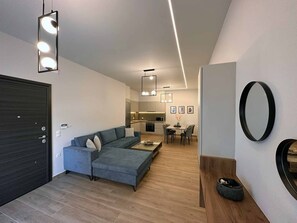 Comfort Apartment, Ground Floor (Armonia) | Living area | 43-inch Smart TV with digital channels - Elia luxury residence (Chalcis)
