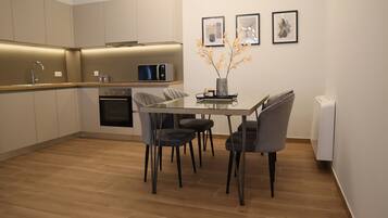 Comfort Apartment, Ground Floor (Armonia) | Living area | 43-inch Smart TV with digital channels