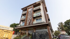 A multi-story hotel with a modern design, featuring balconies and a prominent sign for 'Four Seasons Boutique Hotel'. - Treebo Four Seasons, Near Mysore Palace (Mysore)