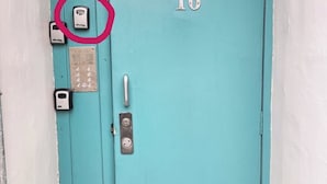 A teal door with a keypad lock, a door number '16', and a metal handle. - Luxury Apartment - Central Dundee - Pet Friendly (Dundee)