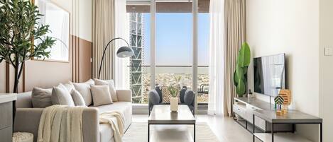 Elite Apartment | Living area | 43-inch LED TV with cable channels