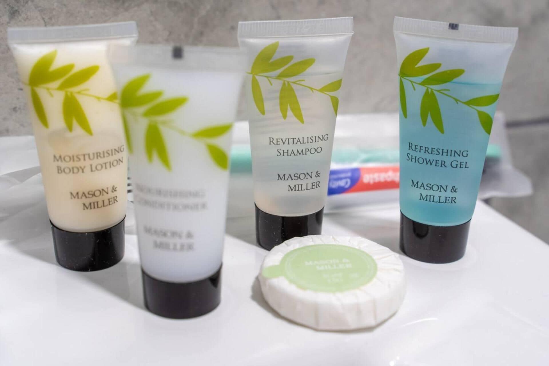 Four Mason & Miller toiletries on a white surface.