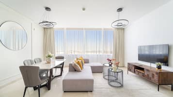 Panoramic Apartment | Living area | 50-inch Smart TV with digital channels