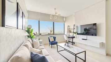 Appartement Confort | Coin séjour | TV connectée de 50 pouces avec chaßnes numériques