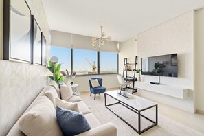 Comfort Apartment | Living area | 50-inch Smart TV with digital channels