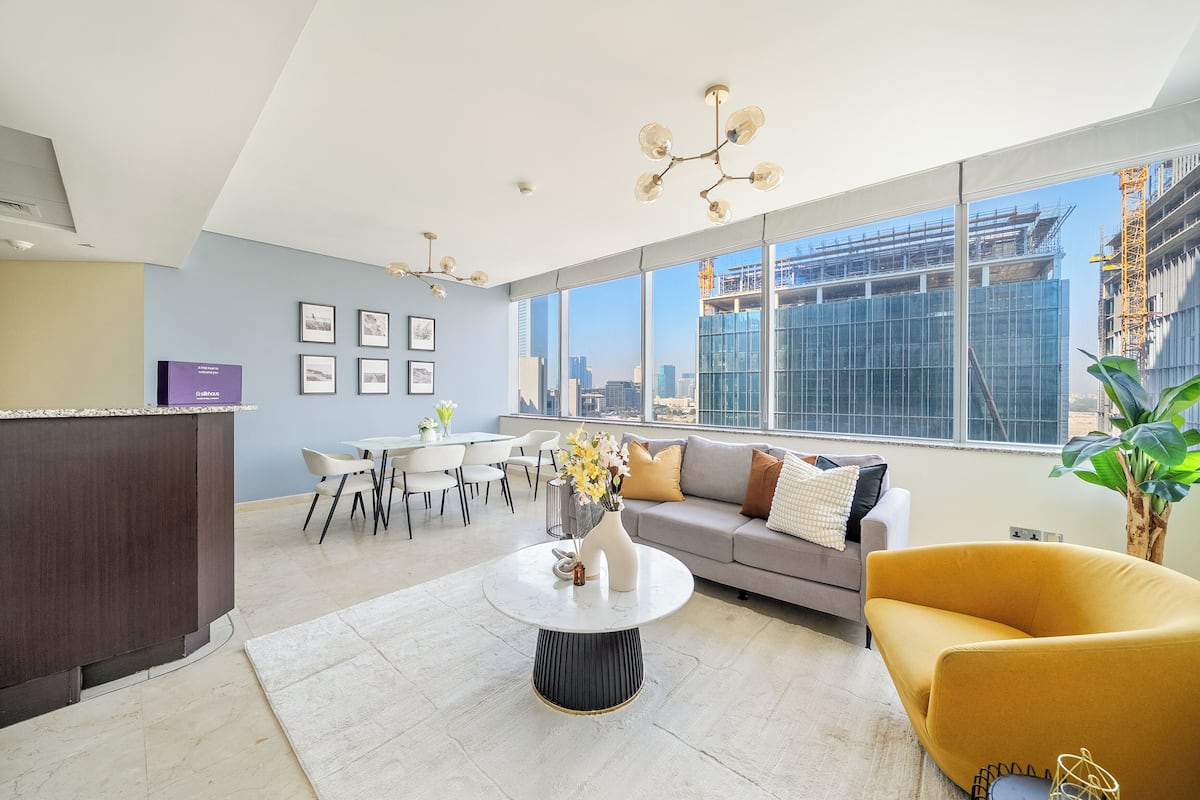 Superior Apartment | Living area | 50-inch Smart TV with digital channels