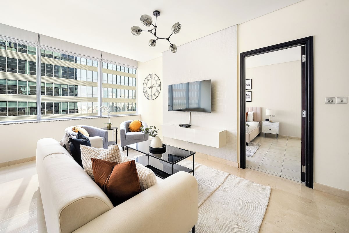 Elite Apartment | Living area | 50-inch Smart TV with digital channels