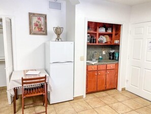 Fridge, microwave, stovetop, coffee/tea maker