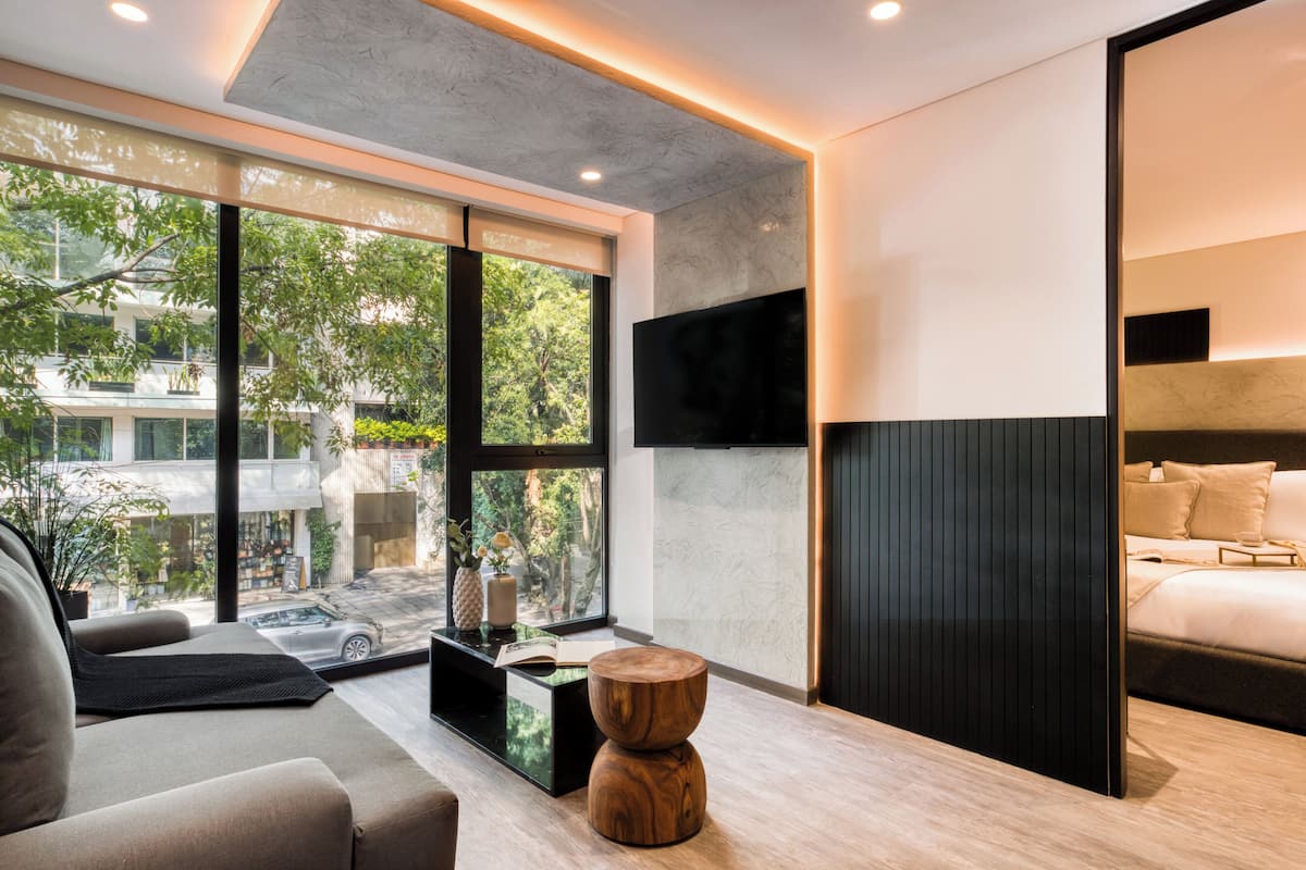 Deluxe Apartment | Living area | 50-inch Smart TV with digital channels, Netflix, streaming services