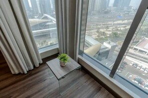 Enjoy a city view from the comfort of your room, with a large window offering a view of the surrounding urban landscape.