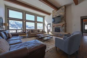 Floor to ceiling beauty in the spacious living room.  #Room with a view