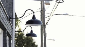 A street view with a building on the left, a street lamp, and a road with cars. - Cute & Friendly 1-BR 10 Mins From Nash (Nashville)