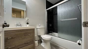 Shower, hair dryer, towels, toilet paper