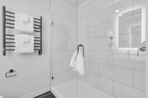 Shower, hair dryer, towels, shampoo