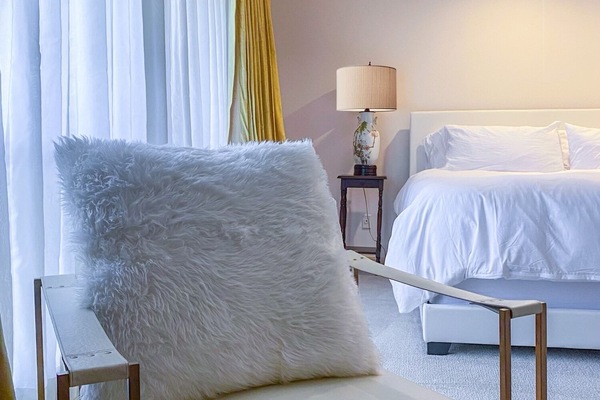 Enjoy a beautiful suite with sitting nook and private bathroom, for your stay.