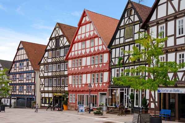 A row of traditional half-timbered buildings with a clear sky.