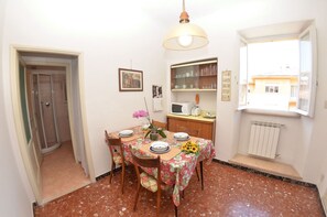 Enjoy meals in this cozy dining area with a round table for four, microwave, and toaster.