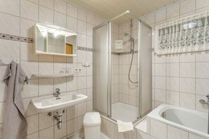 Shower, hair dryer, towels