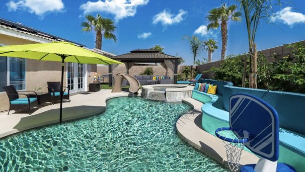A pool area with lounge chairs, a basketball hoop, and a gazebo. - Desert Paradise - Arcade, Casino, Spa, Play Area, Water Slide, Pool Table (Indio)
