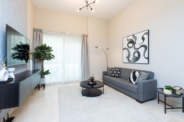 Design Apartment | Living area | 55-inch Smart TV with cable channels -  Grand Luxury - Elegant Apartment in the Heart of Business Bay (Dubai)
