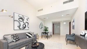Design Apartment | Living area | 55-inch Smart TV with cable channels -  Grand Luxury - Elegant Apartment in the Heart of Business Bay (Dubai)