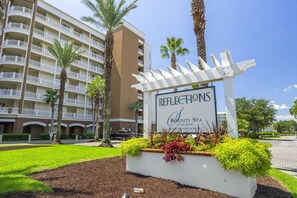 A hotel sign with 'Reflections' and 'Serenity Spa at bay point' indicating a spa and resort.