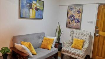 Business Apartment | Living area | 24-inch Smart TV with digital channels