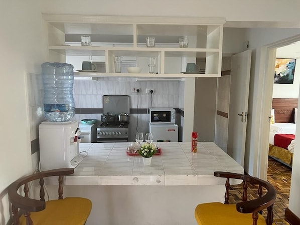Fridge, microwave, cookware/dishes/utensils